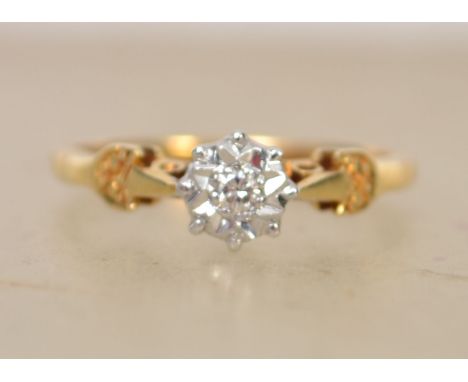 A hallmarked 18ct gold and diamond solitaire ring with illusion star set diamond in a pierced gallery. Hallmarked Birmingham.