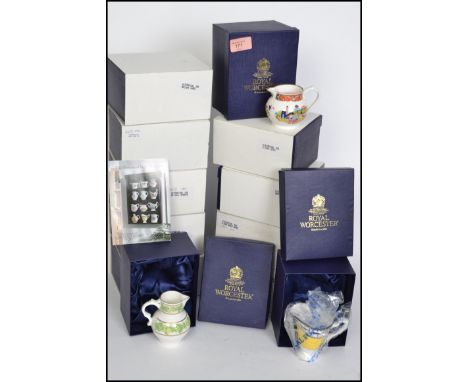 Royal Worcester jugs - a set of twelve 250th Anniversary jugs decorated in 18th to 20th Century patterns, various sizes, Worc