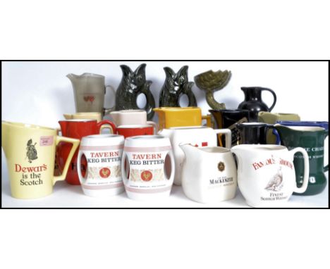 A collection of vintage and retro 20th century ceramic advertising water jugs with jugs having notation for Courage, Teachers