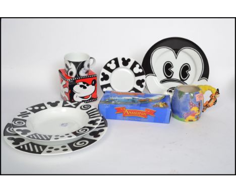 A collection of Disney related ceramic collectors items to include black and white Mickey Mouse plates, cups, saucers and a W