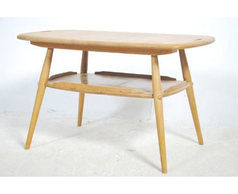 A rare vintage Ercol butler / tray table designed by Lucian Ercolani as part of the Windsor range. Constructed from elm with 