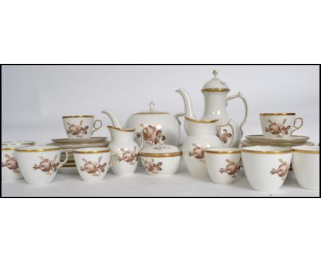 A stunning 20th century Copenhagen porcelain tea service in a gorgeous chintz pattern to include cups, saucers, plates etc. W