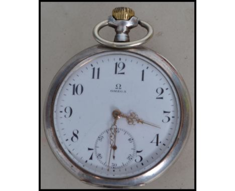 A vintage 20th century Omega gentleman's silver cased pocket watch having winder to top with Arabic numerals gilt faceted han