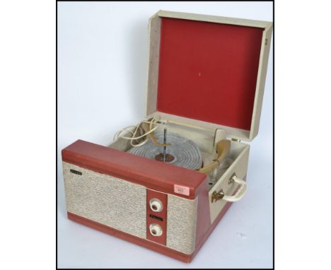A vintage mid 20th century two tone Pilot Encore portable record player. Fitted with a four speed record deck, speaker and kn
