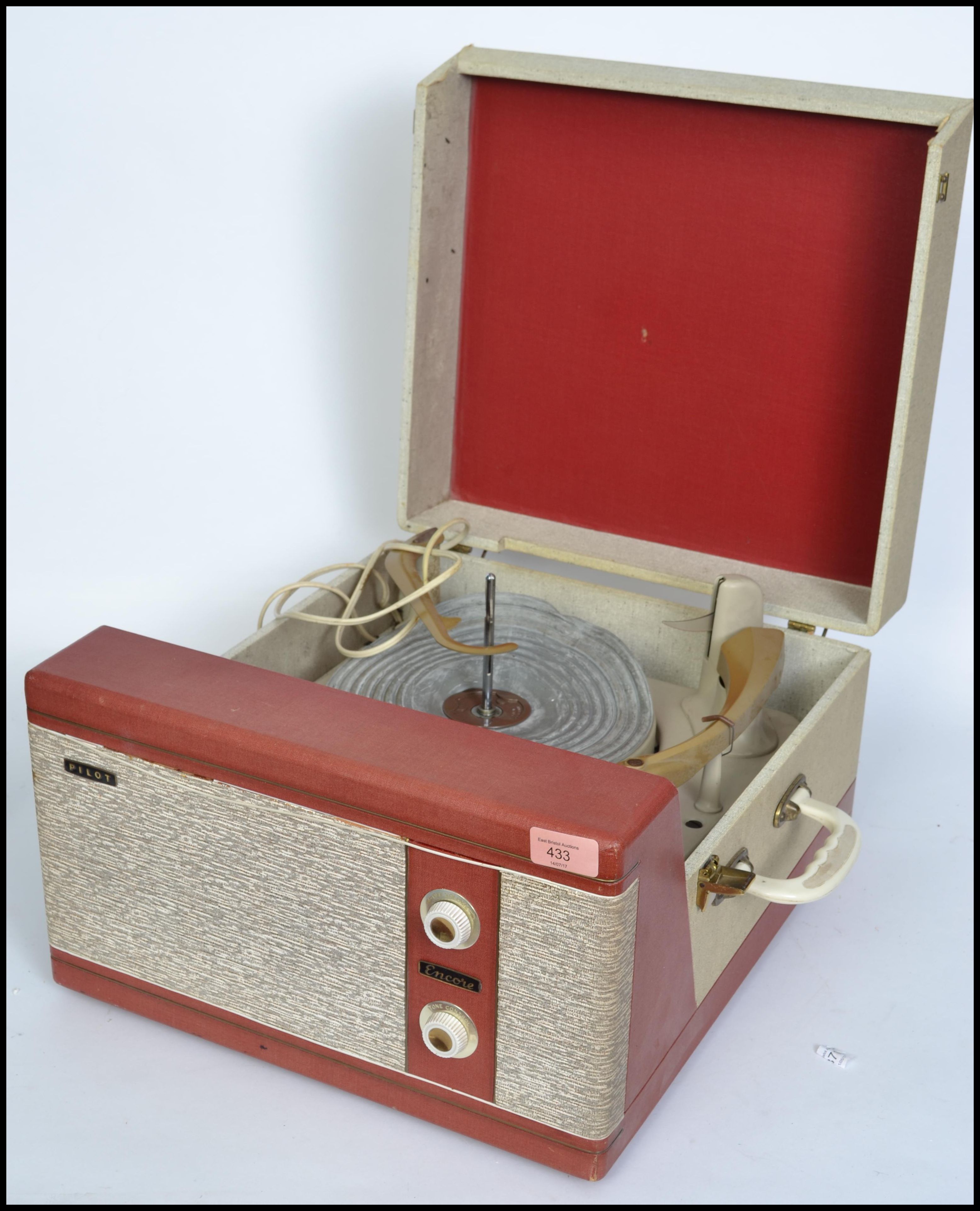 A vintage mid 20th century two tone Pilot Encore portable record player