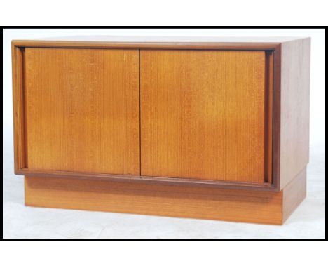 A vintage retro G Plan low teak fresco sideboard record media player unit. Having twin sliding doors with applied G Plan labe