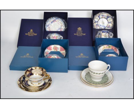 A collection of boxed Royal Worcester ceramic cup saucer and side plate trios to include Connoisseur, Worcester Flowers, Blue