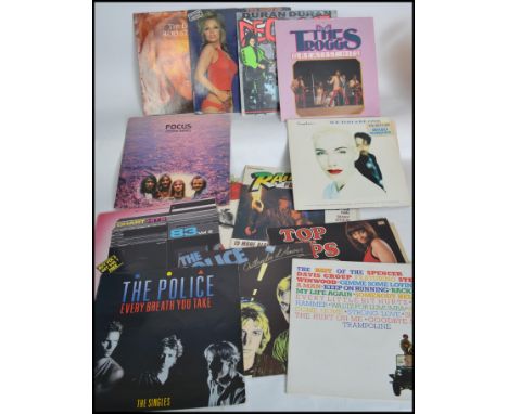 A large collection of vintage long play LP vinyl records to include several artists to include Rod Stewart, Duran Duran, Paul