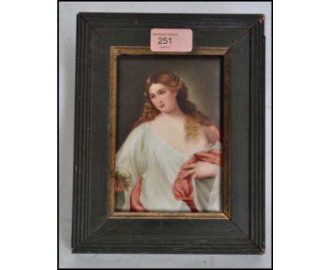 A 19th century oil painting on ceramic tile of a maiden in robes being signed to the corner for A. Ray. Set within a painted 