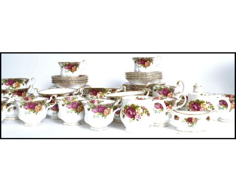 A Royal Albert ' Old Country Roses ' part dinner / tea service comprising cups , saucers plates etc all stamped to the base.M