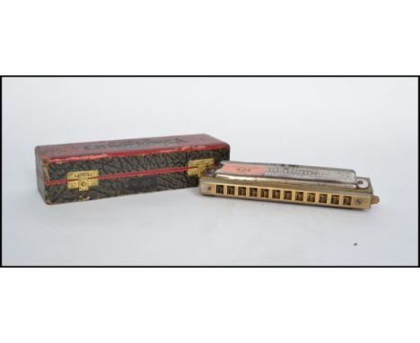 A vintage 20th century The Super Chromonica chromatic harmonica musical instrument by M Hohner No 260 1/2 complete in origina