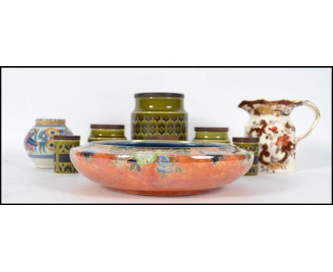 A collection of ceramics to include an Art Deco Grimwades lustre dish with orange ground together with an early Carter, Stabl