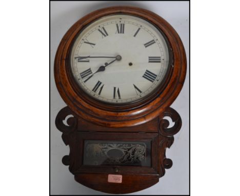 A 19th century American mahogany wall clock with Roman numerals, crossbanding and carved decoration to case. 