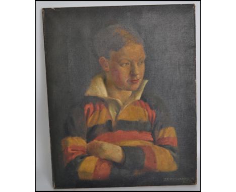 An early 20th century oil on canvas portrait painting of a young chap in a yellow, red and black hooped rugby jersey with arm