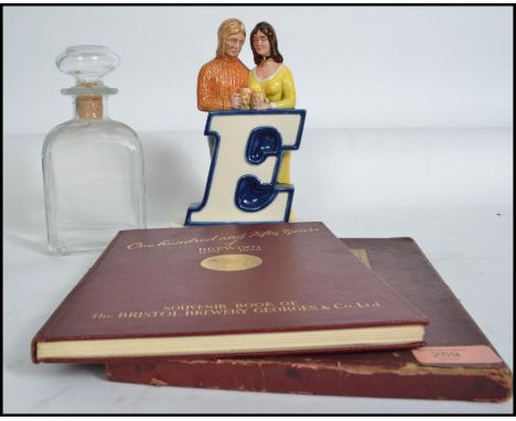 A retro 20th century point of sale breweriana ceramic advertising piece of a young couple at a bar for Worthington E together