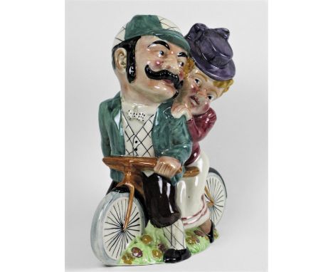 A William Shorter &amp; Son, 'Daisy Bell' Electric Lamp-holder with Daisy and her beau seated on a tandem. Painted in undergl