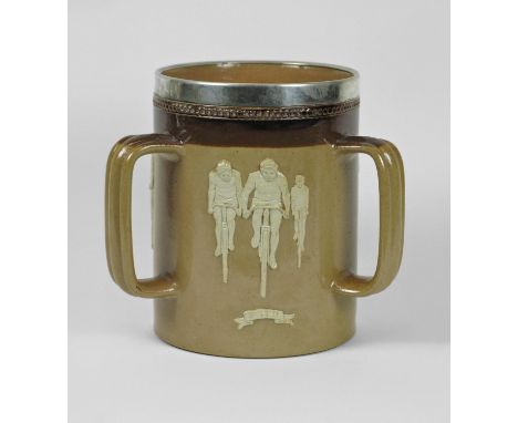 A Tigg by Doulton of Lambeth having three handles and three appliqué depictions of cyclists in different guises: Military, Pa