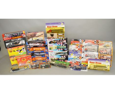 35 boxed and carded diecast model trucks by Maisto, Corgi and others, in a variety of different scales, many of which display