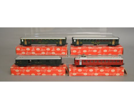 HO Gauge. 4 boxed HAG (Switzerland) Coaches, three in green SBB livery together with a Restaurant Car with Pantograph in red.