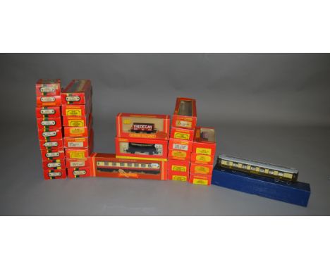 OO Gauge. 11 boxed Hornby Coaches and one unboxed together with 19 boxed Wagons including 2 x R.6038 3 Plank Wagons 'W. Wise'