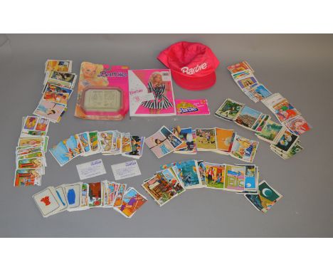 A mixed lot of vintage Barbie doll items, which includes vintage clothing for Barbie or similar dollsa Barbie baseball hat, a