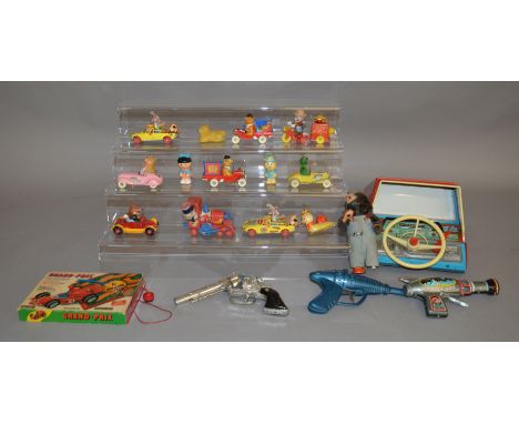 A mixed lot which includes; a tin plate driving simulator toy, tin plate gun, The Magic Roundabout diecast by Corgi etc.