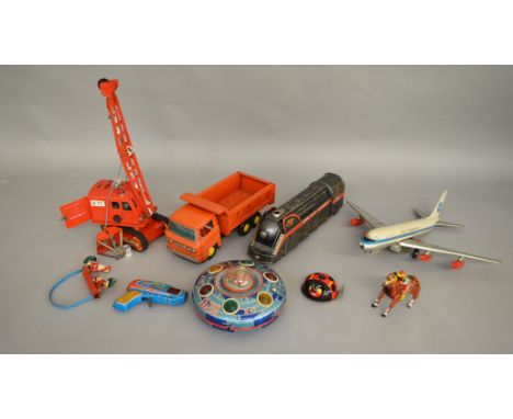 6 vintage Tinplate Toys including a Japanese battery operated 'Overland Express' locomotive and a 'Flying Saucer' both by 'Mo