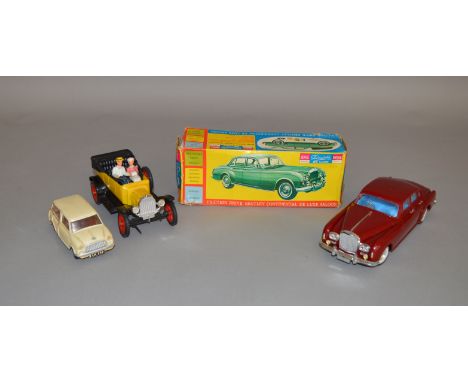 A boxed Telsalda plastic friction drive Bentley Saloon model in maroon with opening bonnet/boot, side windows etc. and retain