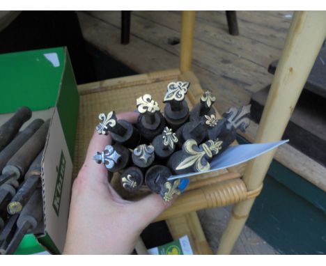 A bundle of 13 finishing tools - all variations of the Fleur de Lis