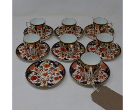 A set of 8 Royal Crown Derby porcelain miniature saucers and 7 cups 