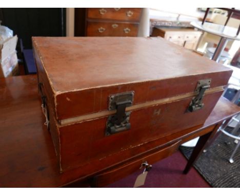 An early 20th Century Chinese tan leather bound trunk with twin carrying handles, H.35cm L.82cm D.56cm 