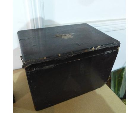 A late 19th / early 20th century Chinese lacquered tea caddy, the hinged lid with crest to top (damaged), the pewter interior