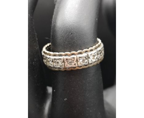 White metal  ring set with clear stones. 