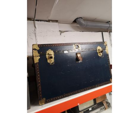 Large blue and brass bounded travel trunk with fitted interior. 