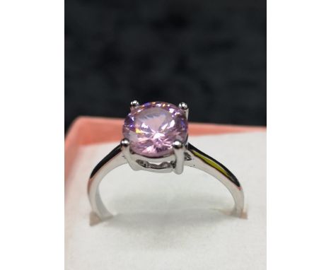 Silver ring set with pink stone. 