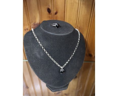 Silver belchar chain set with black stone setting together matching silver ring. 