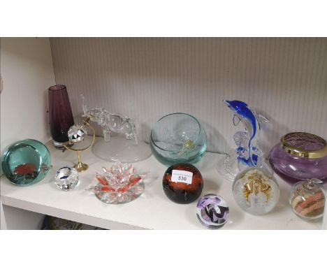 Shelf of Paperweights and art glass. 