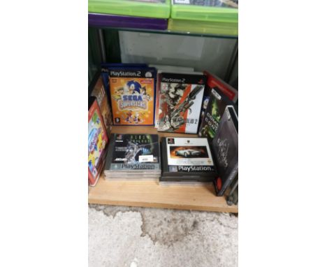 Shelf Of Playstation 2 And Playstation 1 Games 