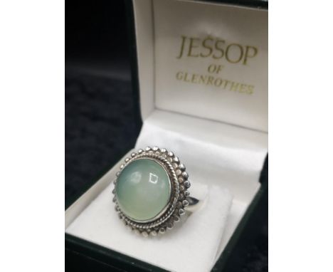 Silver 925 ring set in pale green stone. 