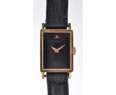 Jaeger LeCoultre: a lady's 18k wristwatch, with plain black dial, leather strap.