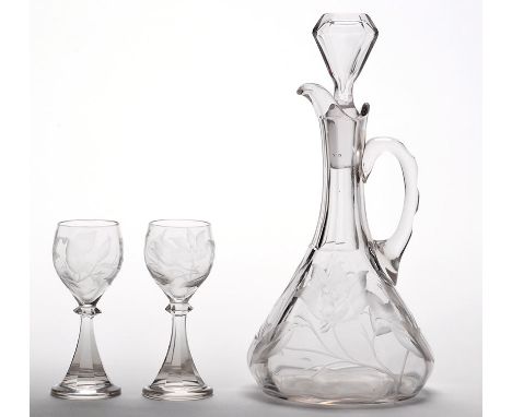'Rock crystal' engraved decanter and two cordial glasses, the decanter and stopper with flowers, buds and foliage beneath fac