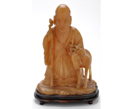 Chinese Alabaster figure of a sage, standing holding a gnarled stick beside a deer, 19th/20th Century, 27cms.