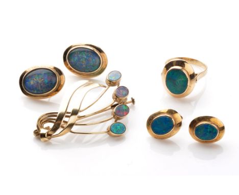 An opal and yellow metal scrolling brooch, stamped '9c', 4cms wide; together with a pair of opal triplet earrings in collet s