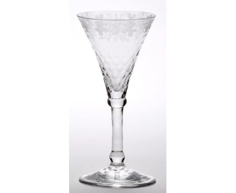 Engraved 'Newcastle' light baluster wine glass, the moulded trumpet bowl with fruiting vines and flower heads encircling the 