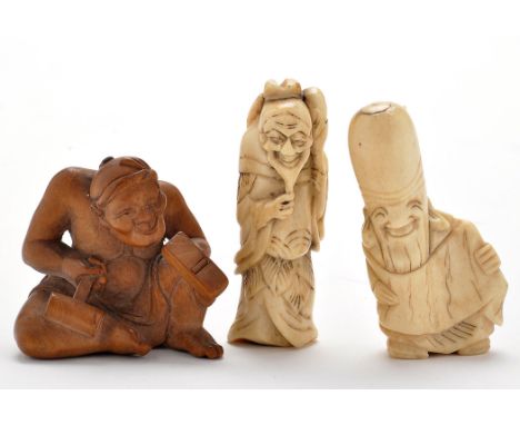 Three Japanese netsuke, comprising: bone figure of a hunched man holding his beard and a gourd, height 6cms; bone figure hold