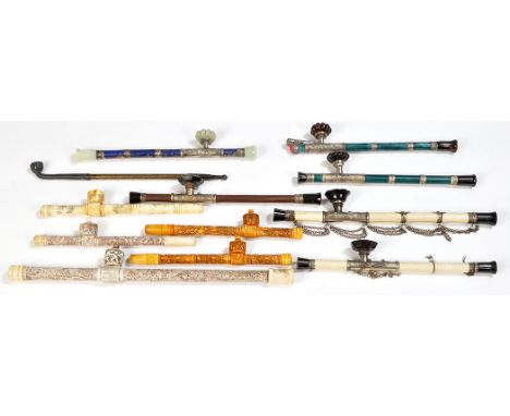 A collection of Chinese late 19th early 20th Century tobacco pipes, to include: two ivory and white metal with possibly stain