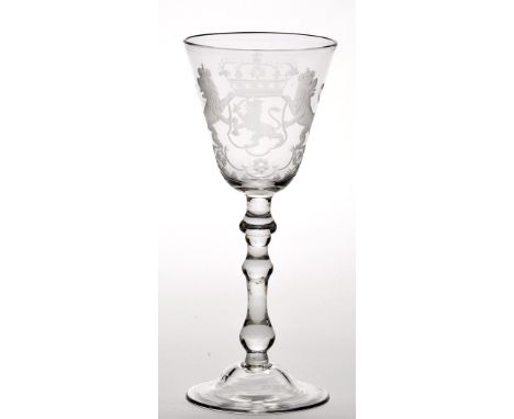 Engraved 'Newcastle' light baluster wine glass, the round funnel bowl with 'Royal' Coat of Arms above drop and true baluster 