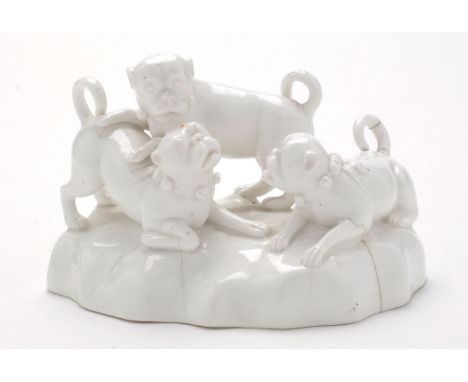 Continental Whiteware model of three pug dogs playing, length 18cms. pseudo underglaze Derby mark.