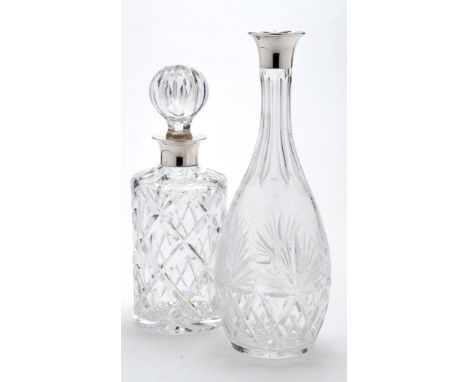 An Elizabeth II cut glass and silver mounted decanter, by C.S. Green & Co., Birmingham modern, ovoid with slender stopper, 15