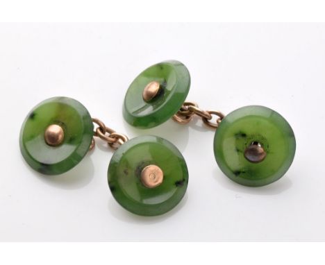 A pair of jadeite cufflinks, with yellow metal central mounts and chains, in an Aspreys, London box.